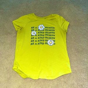 This is an inspirational shirt that quotes be a kind human and it’s yellow!